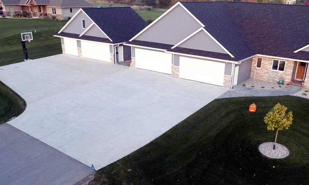 What maintenance tips do concrete driveway contractors recommend?
